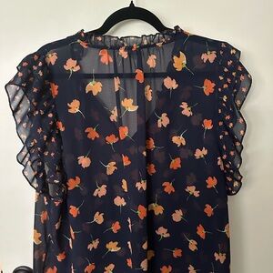 CABI Navy blue with floral accents sheer blouse.
